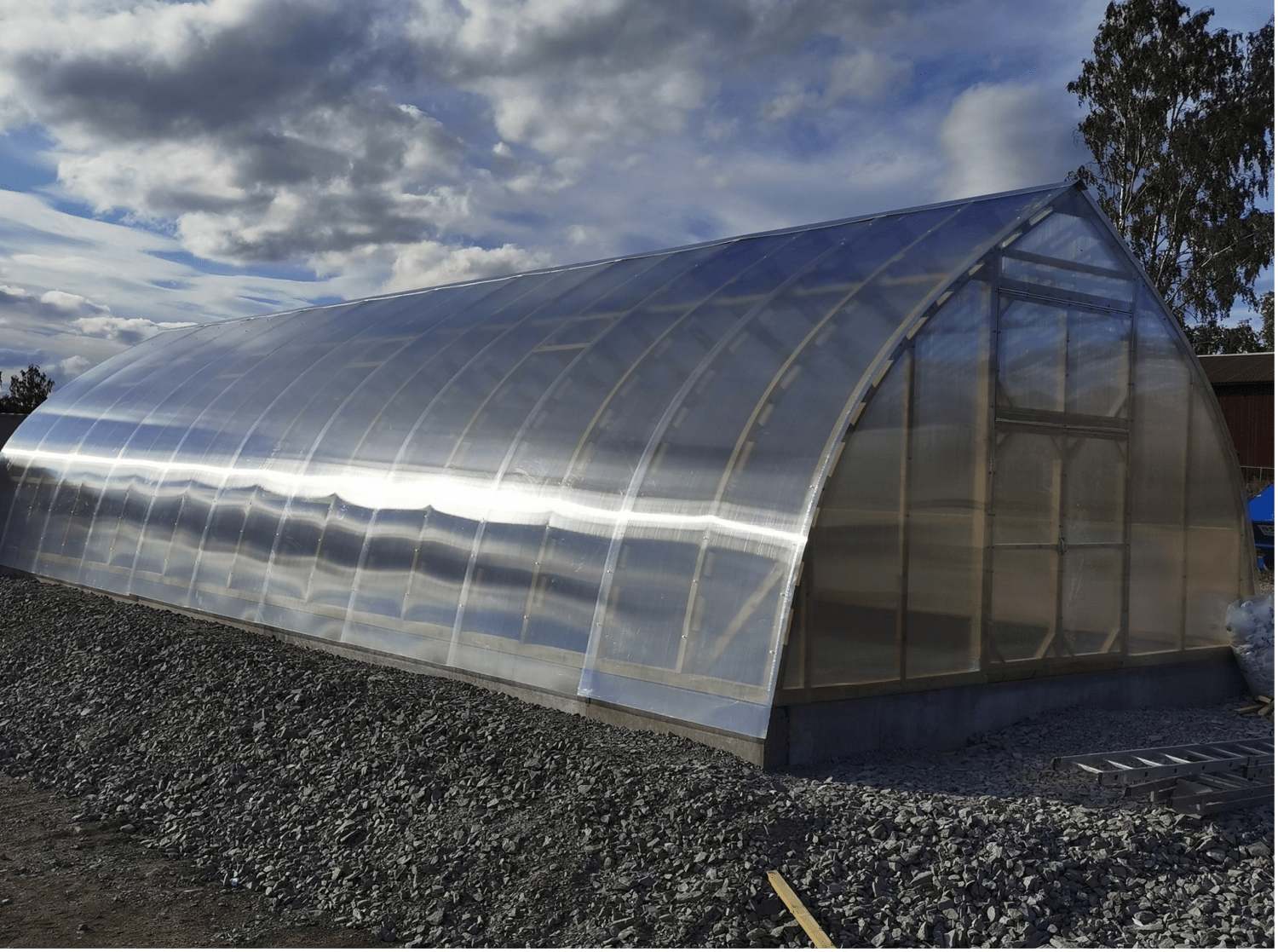 Exterior view showcasing the stylish greenhouse frame