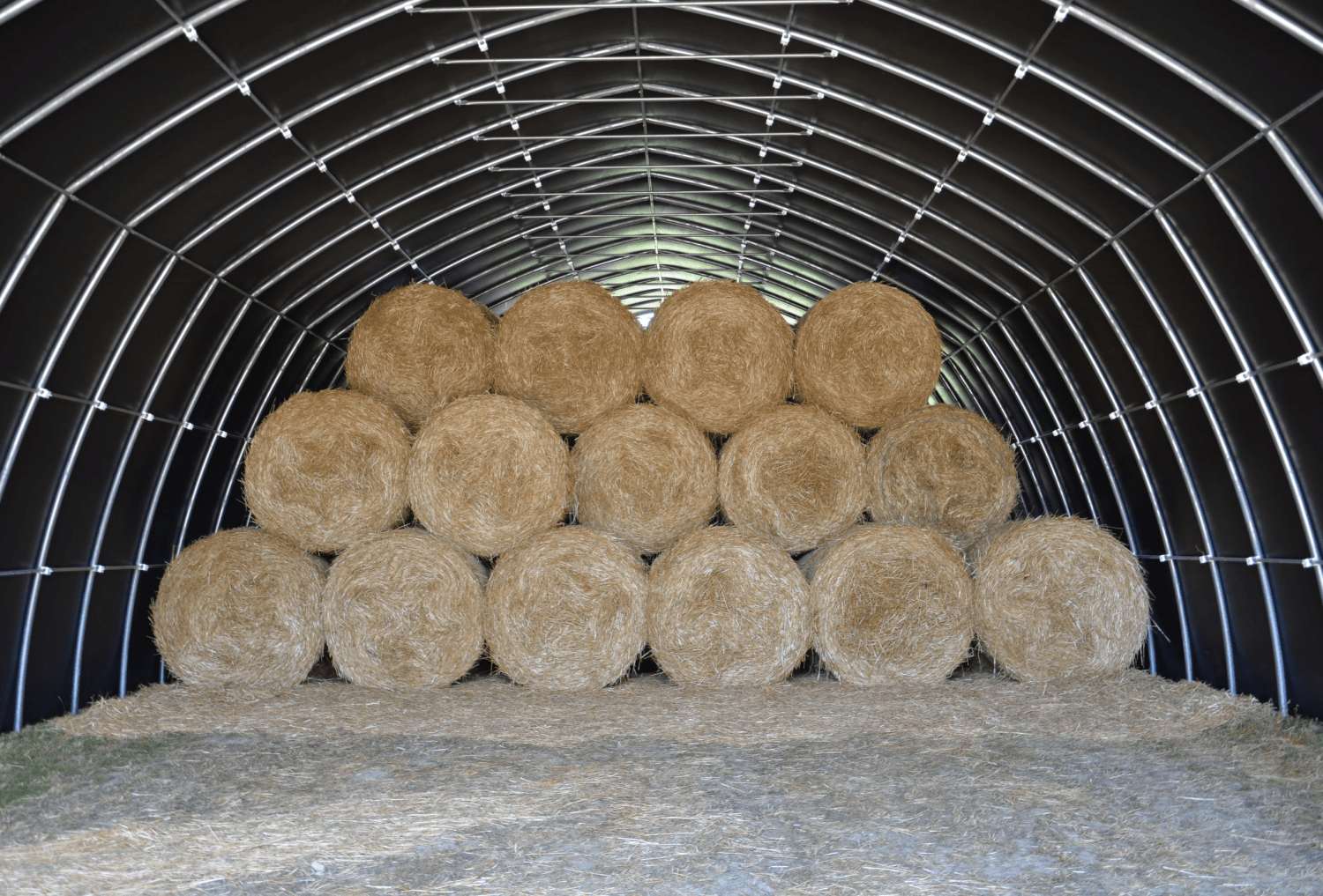 Interior view of plastic hall with hay bales